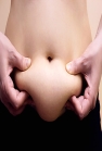 woman squeezing belly fat